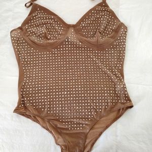 Rhinestone bodysuit by Top Chic. Never worn. Size Large, but more like a Med.